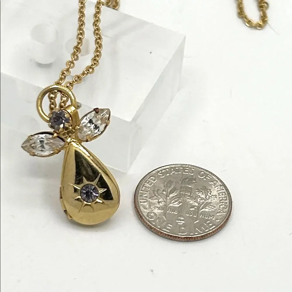 Vintage gold tone angel pendant locket birthstone necklace - purple rhinestone